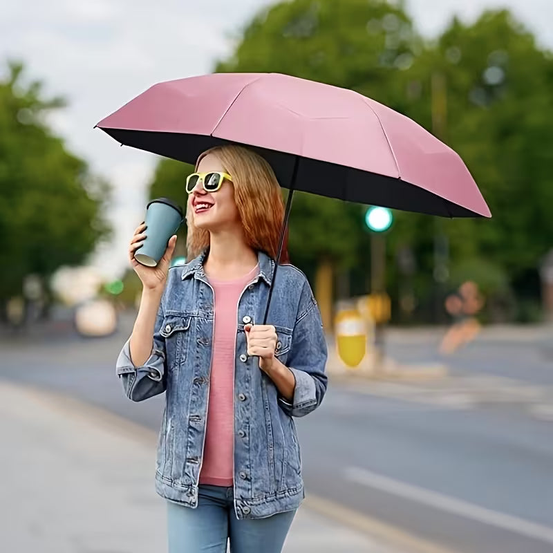 Kleiner StekaShop Mini-Taschenschirm mit schwarzem Regenschirmbezug, handlich und leicht, ideal für unterwegs bei Regen.